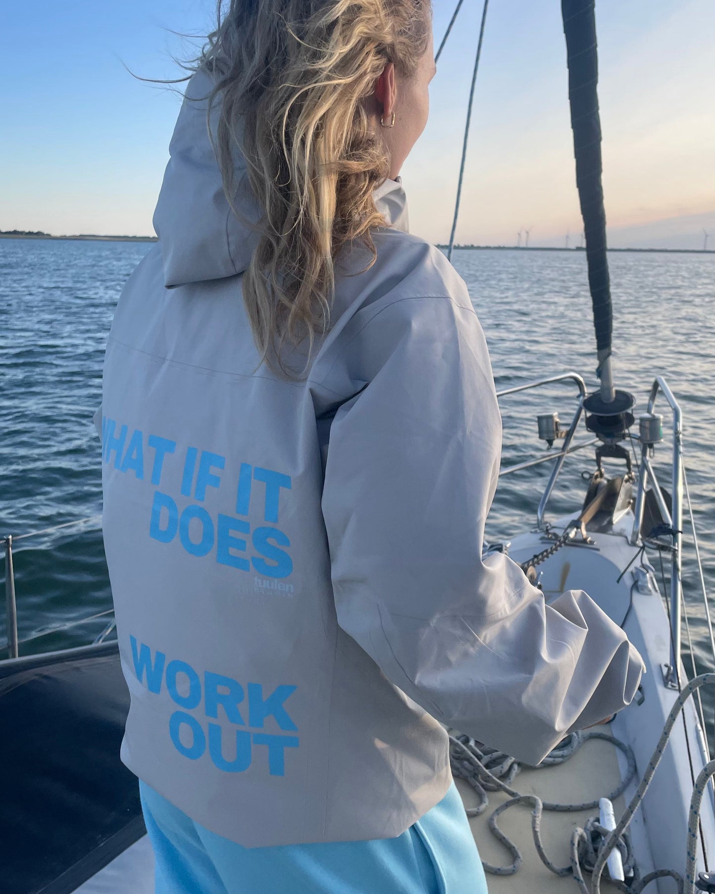 Shell jacket with text: what if does work out